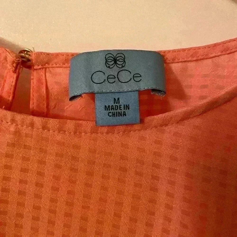 Cece beautiful peach blouse. This blouse has bell sleeves with tie closures. - Picture 2 of 7